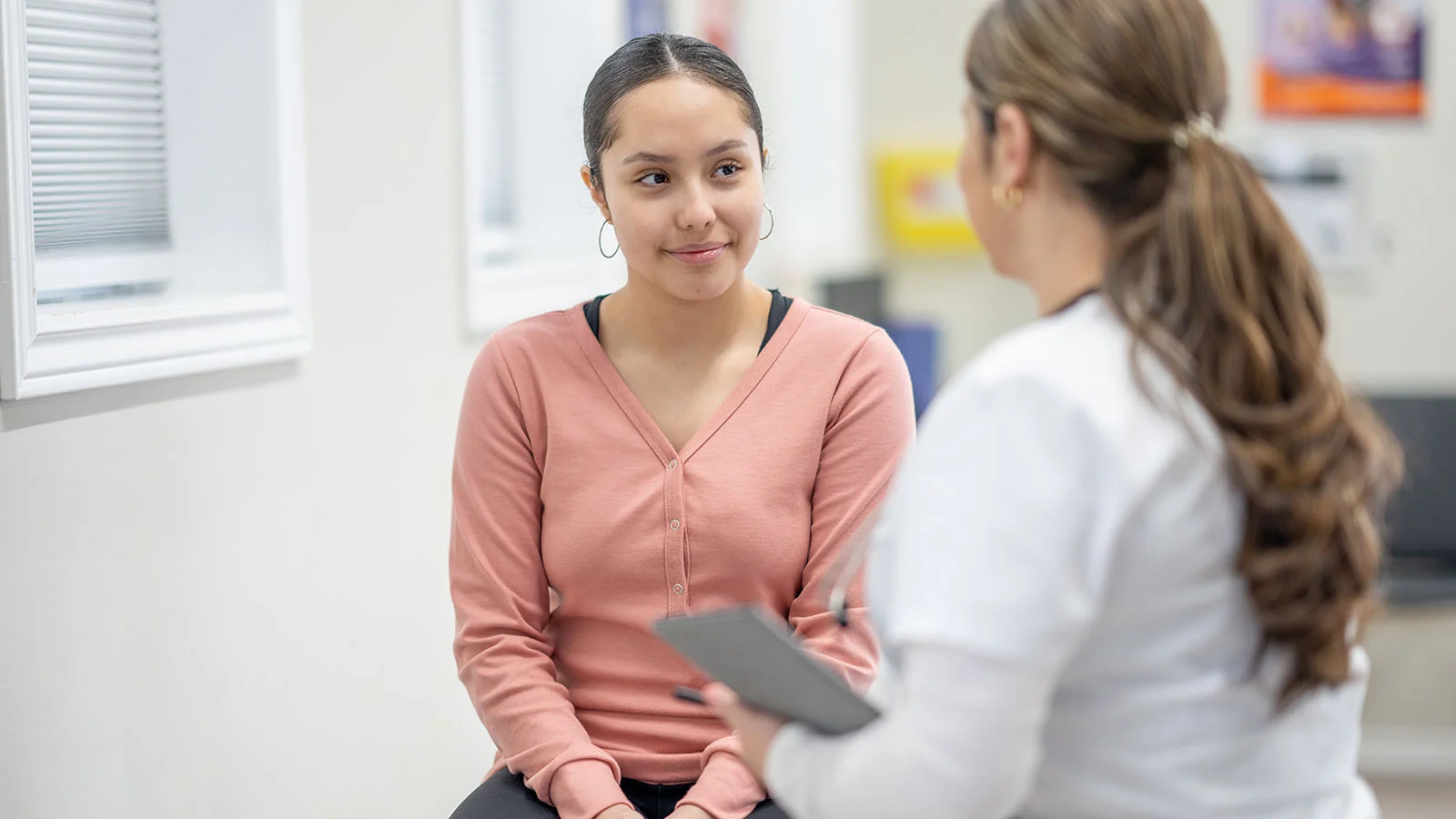 Teen patient and caregiver
